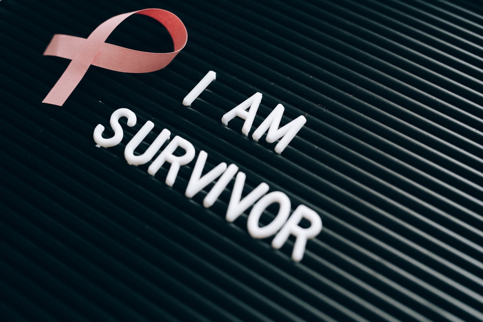 i am survivor note on a letter board